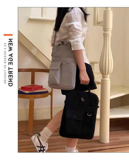 Large-capacity 13-inch laptop bag for men and women commuting business trip shoulder slung handbag.