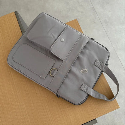 Large-capacity 13-inch laptop bag for men and women commuting business trip shoulder slung handbag.