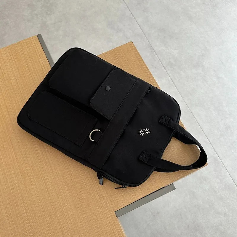 Large-capacity 13-inch laptop bag for men and women commuting business trip shoulder slung handbag.