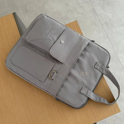 Large-capacity 13-inch laptop bag for men and women commuting business trip shoulder slung handbag.